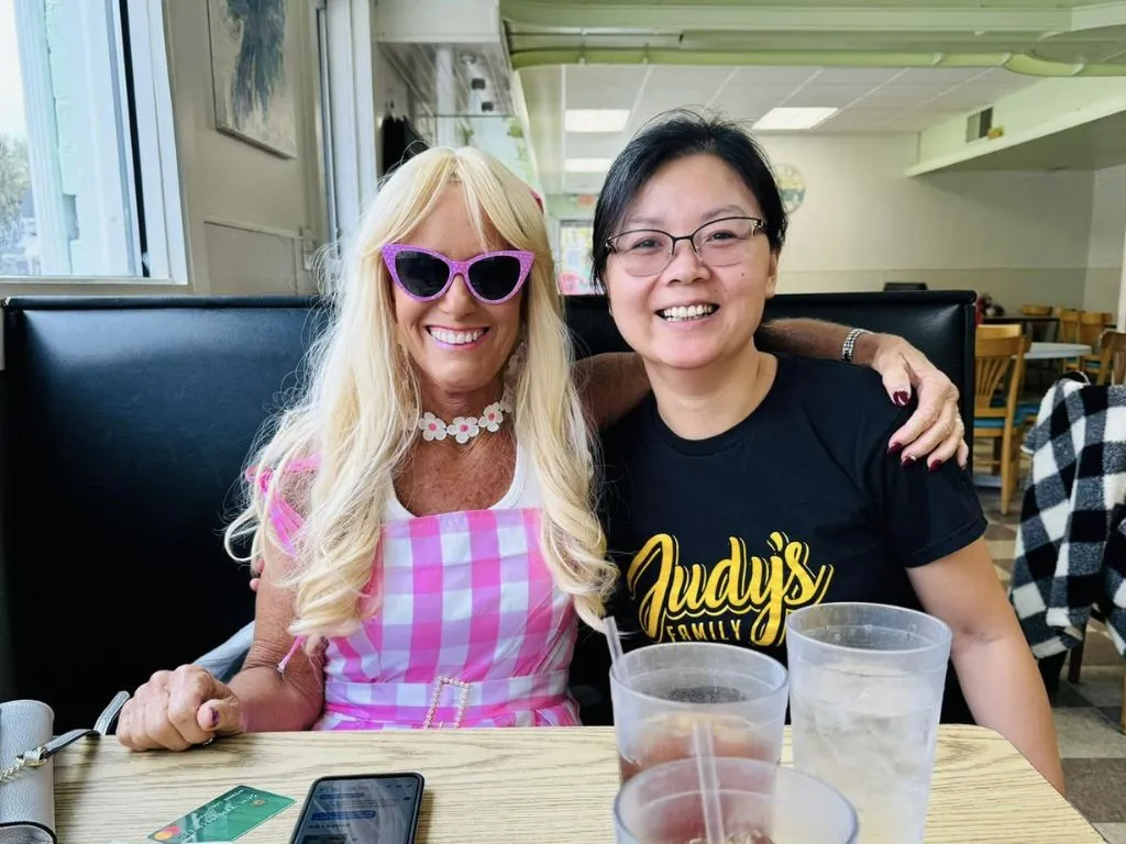 judy with woman in pink dress