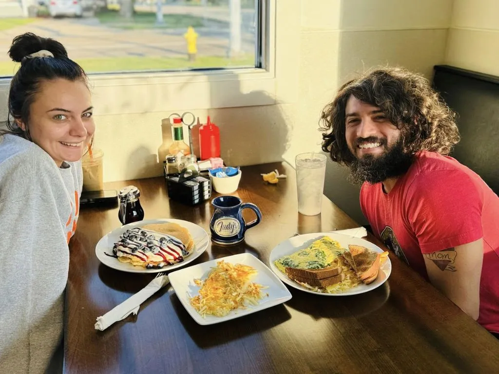 young couple eating breakfast