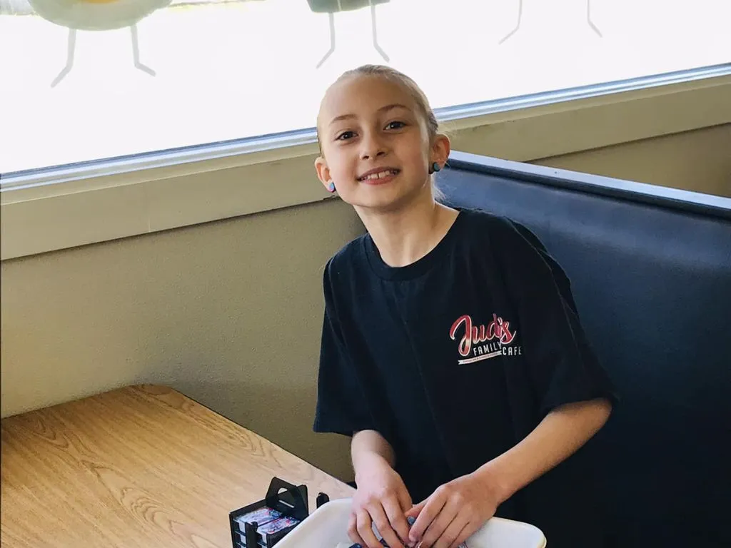 young girl helping at judys cafe